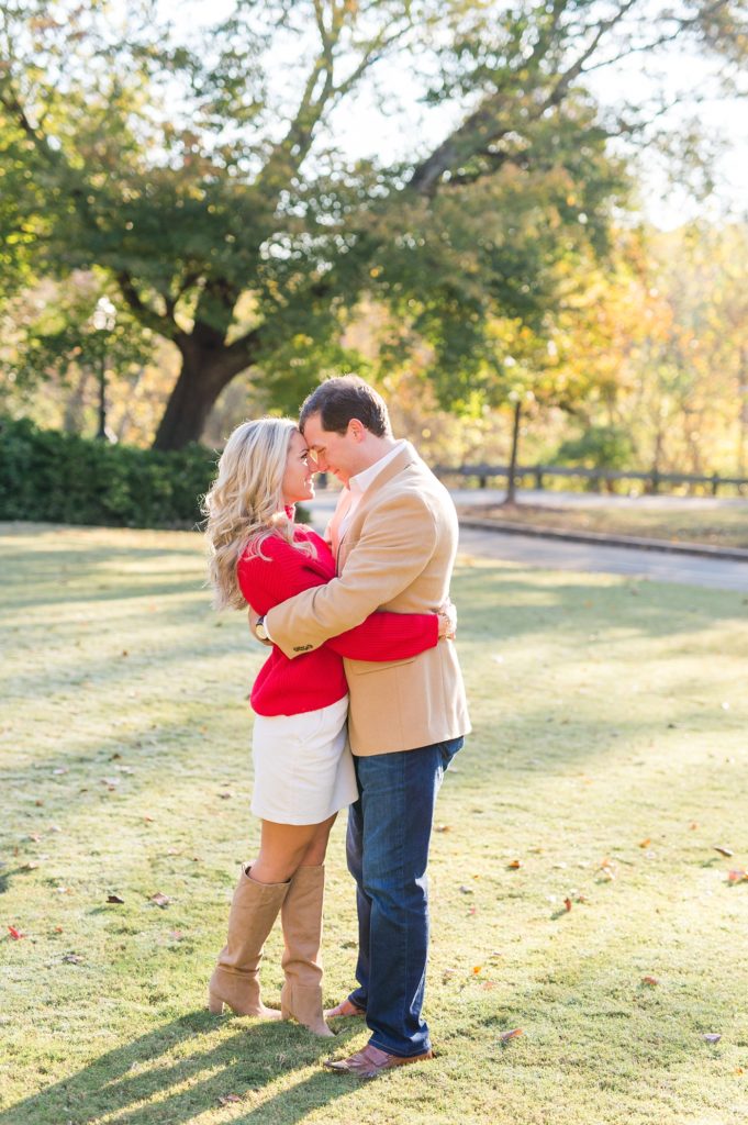 engaged couple hugging at piedmont park engagement session