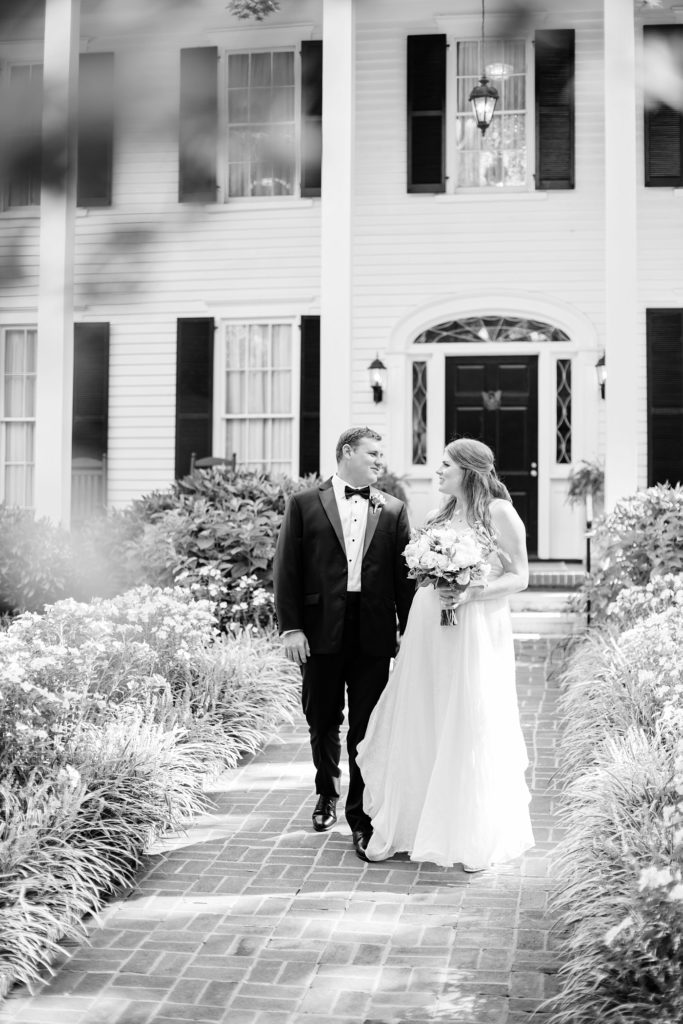 bride and groom walking together at their flint hill wedding