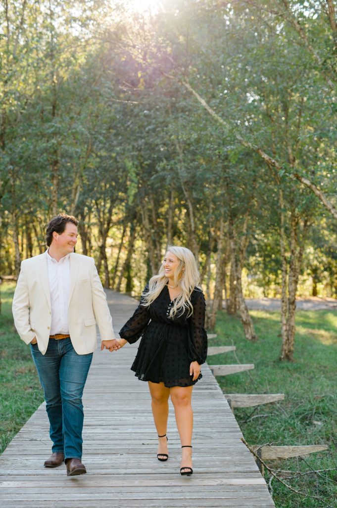 walking together for their serenbe engagement photos