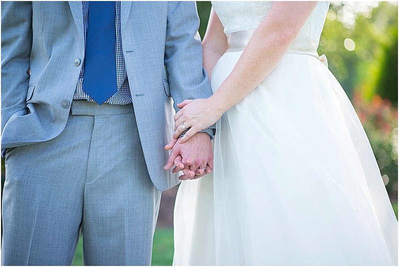 newlyweds holding hands | Photography by Laura Barnes Photo