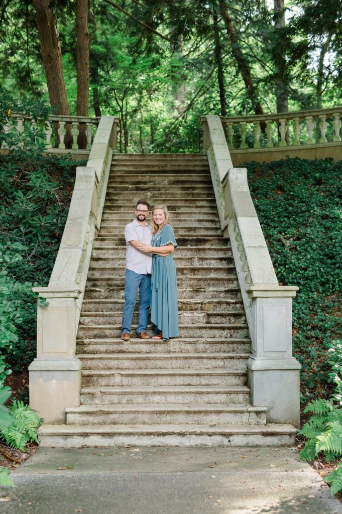 couple smiling on staircase at cator woolford gardens