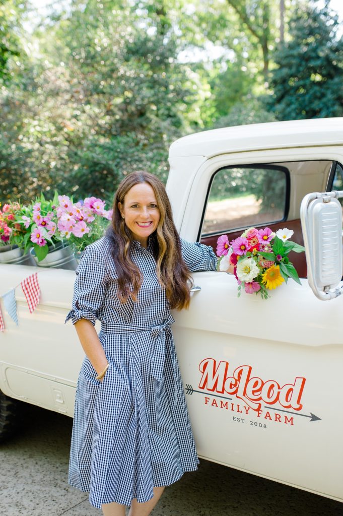 mcleod family farm flower truck with women smiling and holding flowers