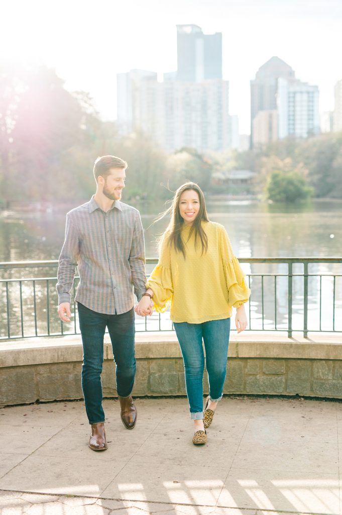 engaged couple smiling at piedmont park engagement session