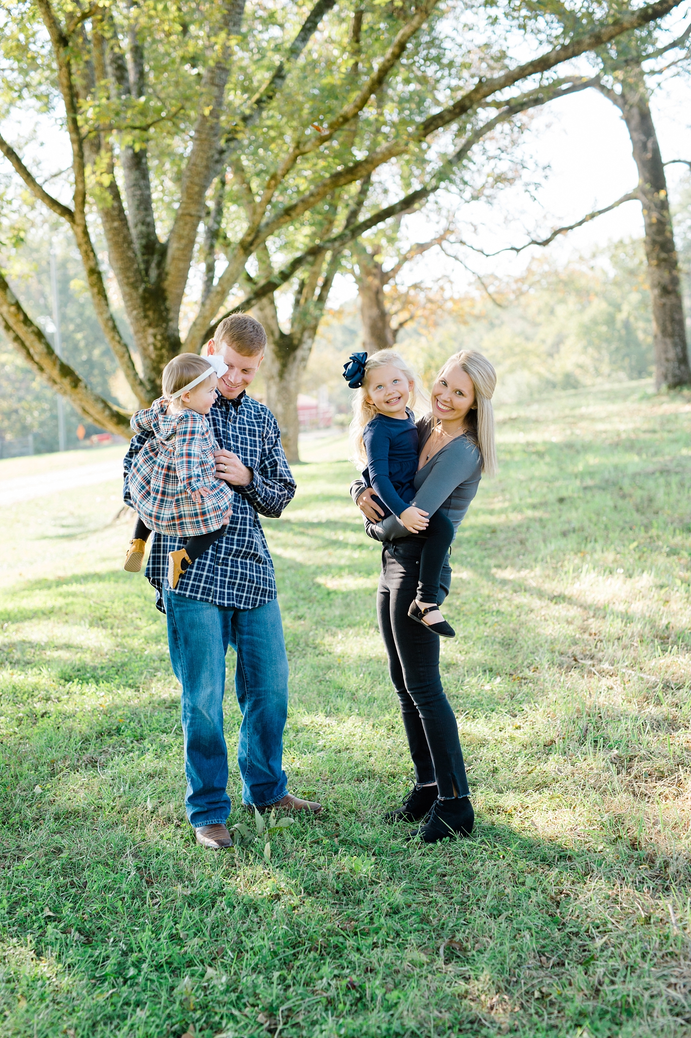 west georgia family photographer family session at sweet meadows farm family laughing together
